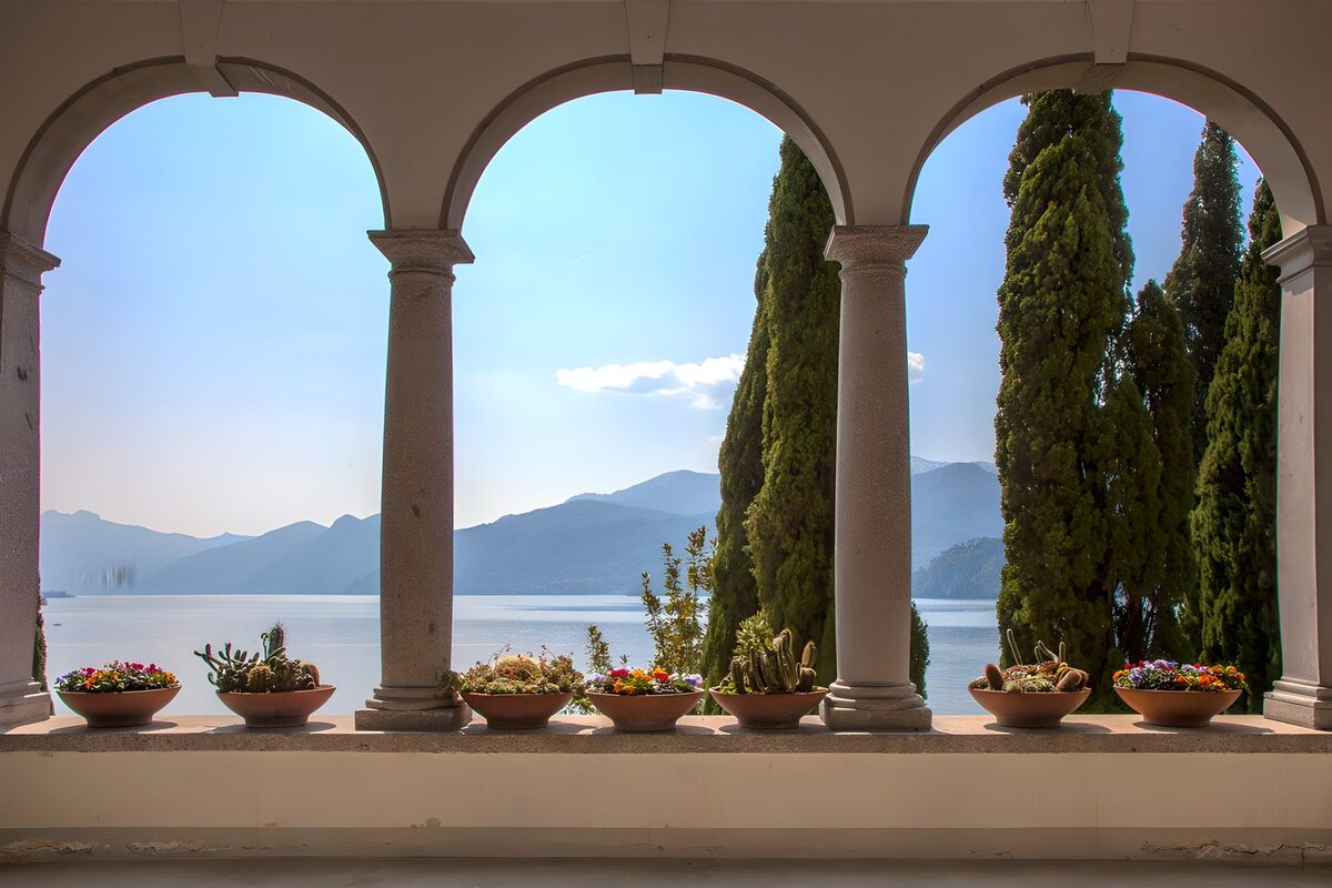 Lake and mountains through shaded arches