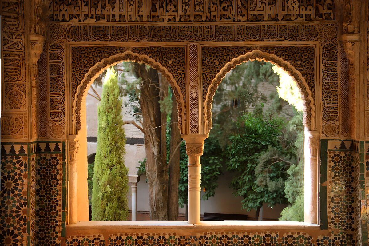 Carved arches over a shaded courtyard