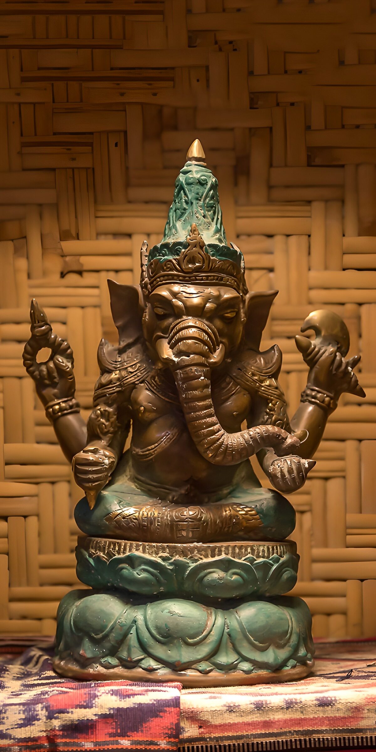 Bronze and turquoise Ganesha at rest