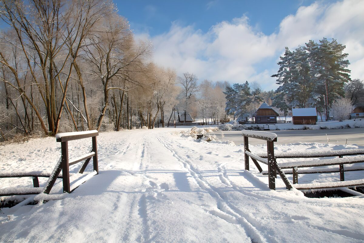 Snowy footbridge in the winter sun