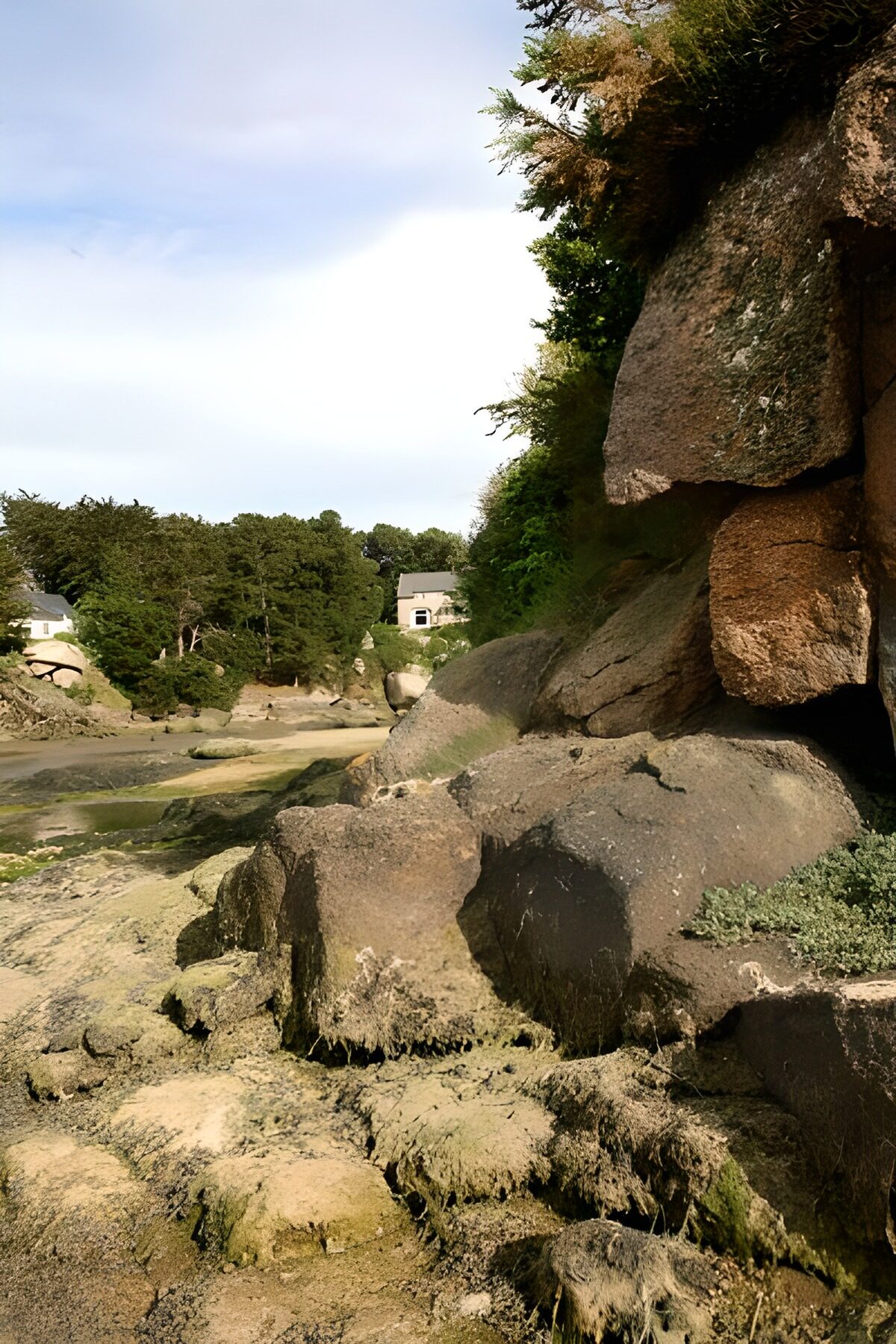 A sheltered rocky inlet at low tide