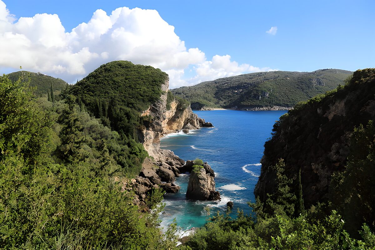 Sunlit cliffs above a turquoise bay