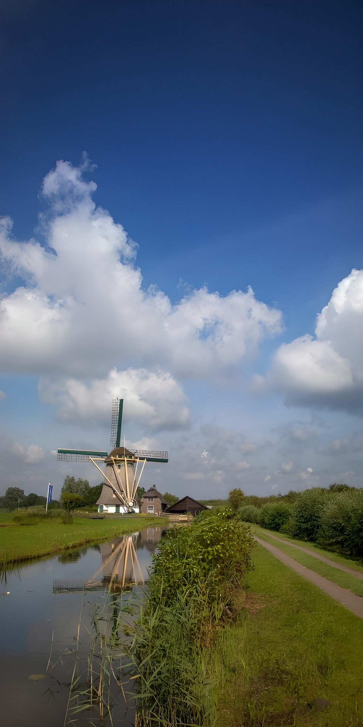 Windmill by a quiet country waterway