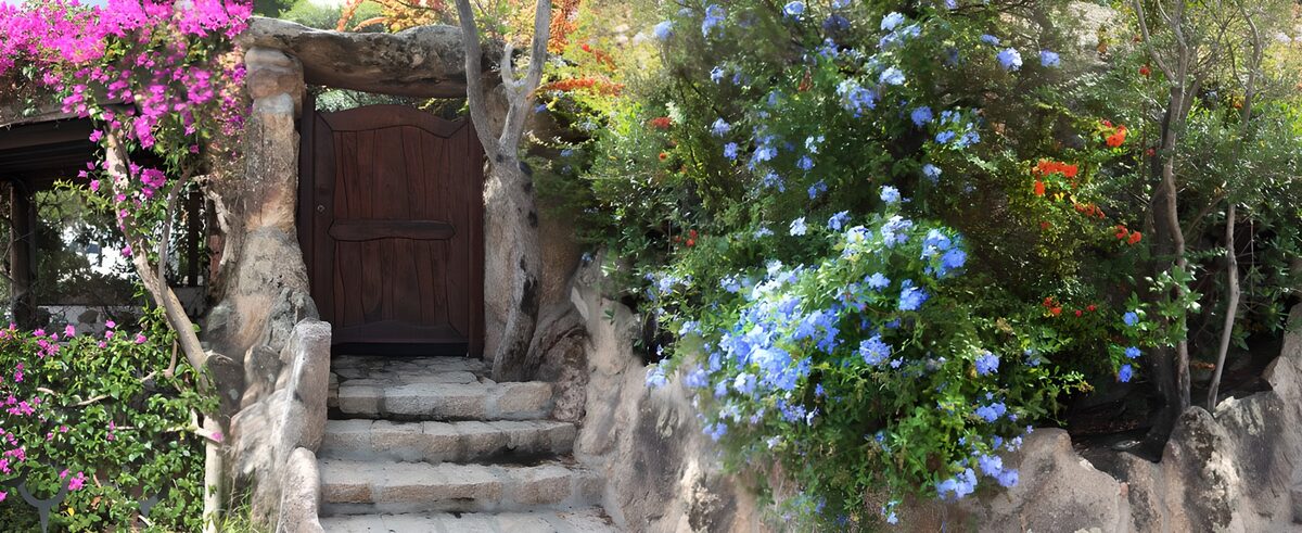 Stone steps to a flower-framed door