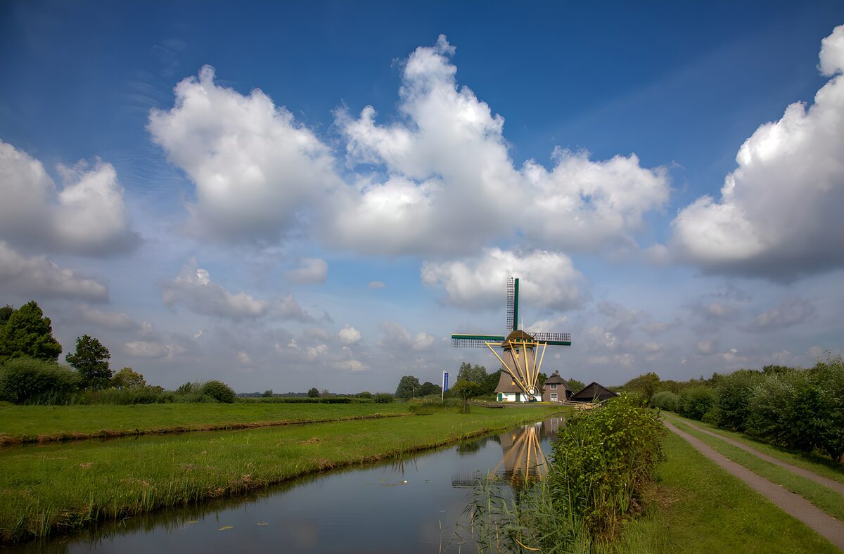 Windmill beside a quiet country canal