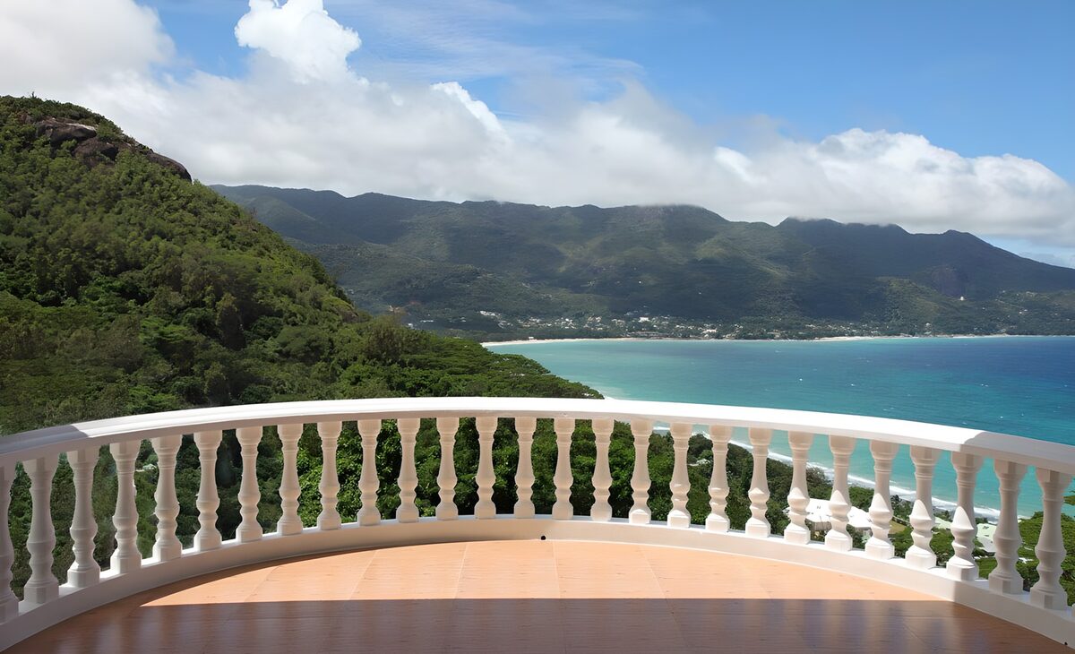 Sunny balcony above a turquoise bay