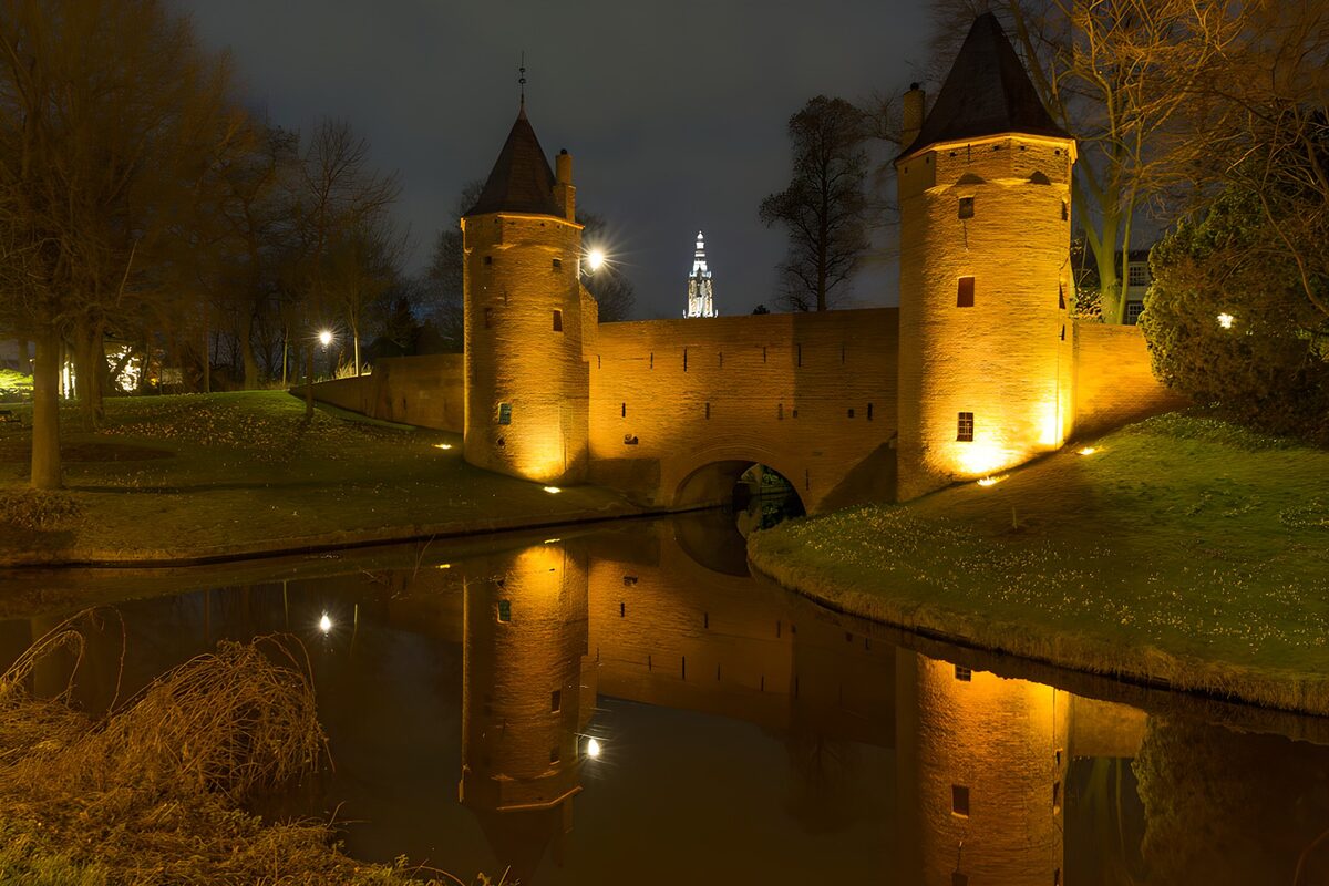 Floodlit water gate after dark