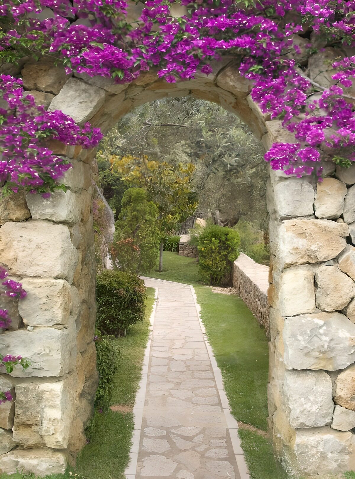 Stone arch over a quiet garden path