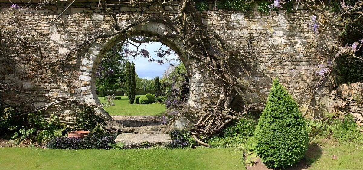 Sunlit stone arch and garden steps