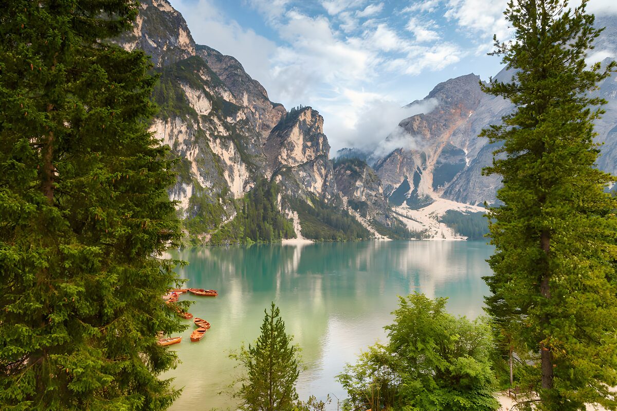 Turquoise lake beneath clouded peaks