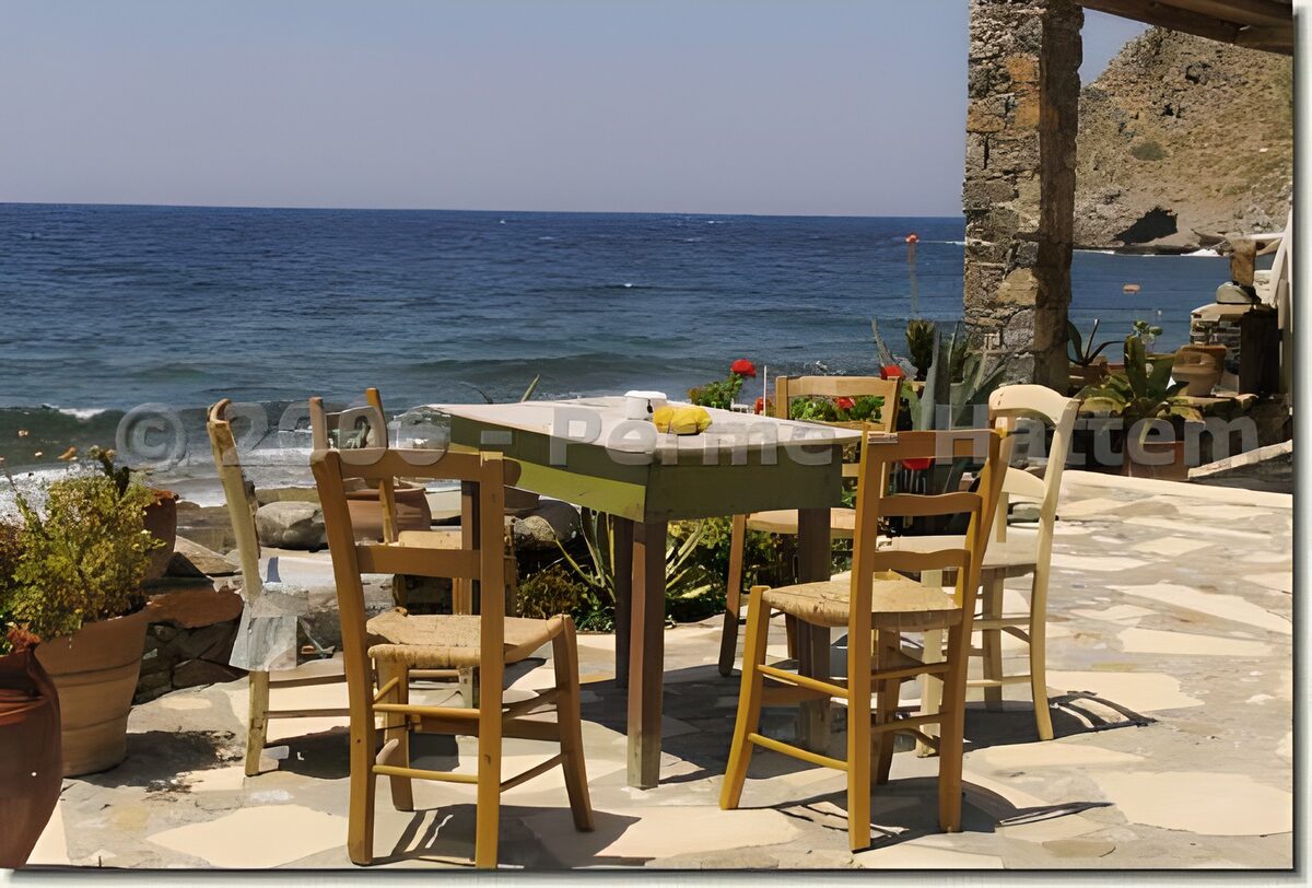Sunlit terrace with a table by the sea