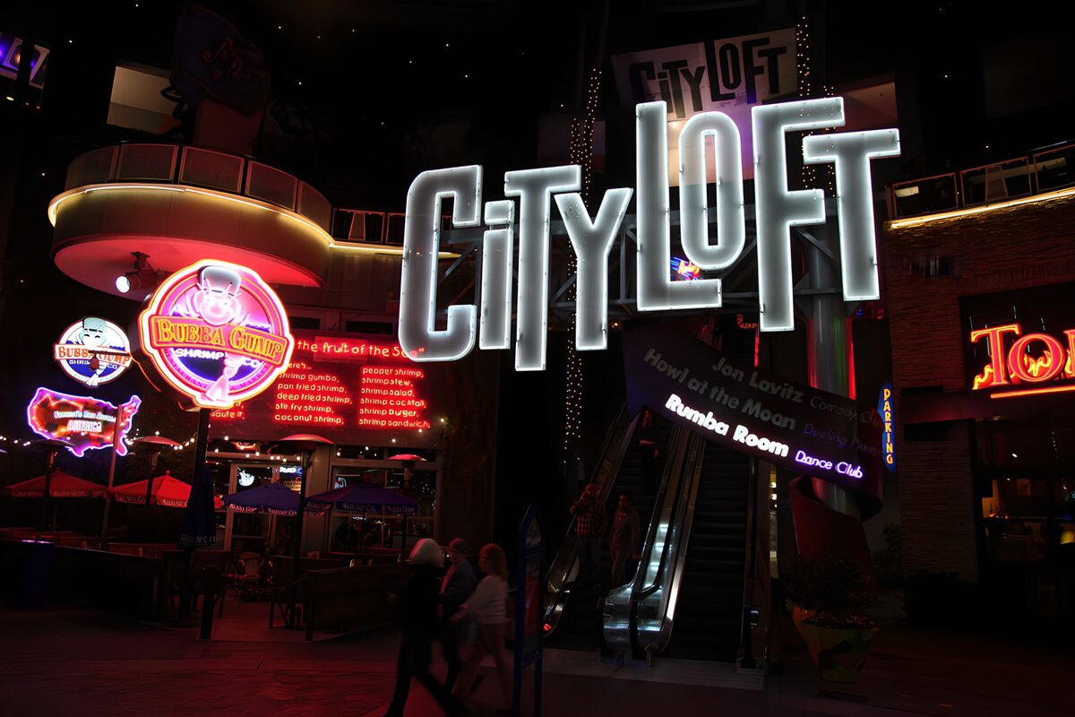 Neon signs and escalators after dark
