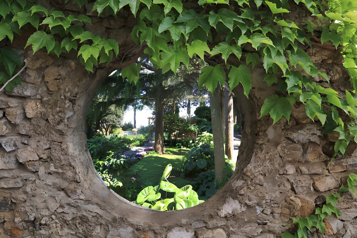 Shady garden through a stone opening