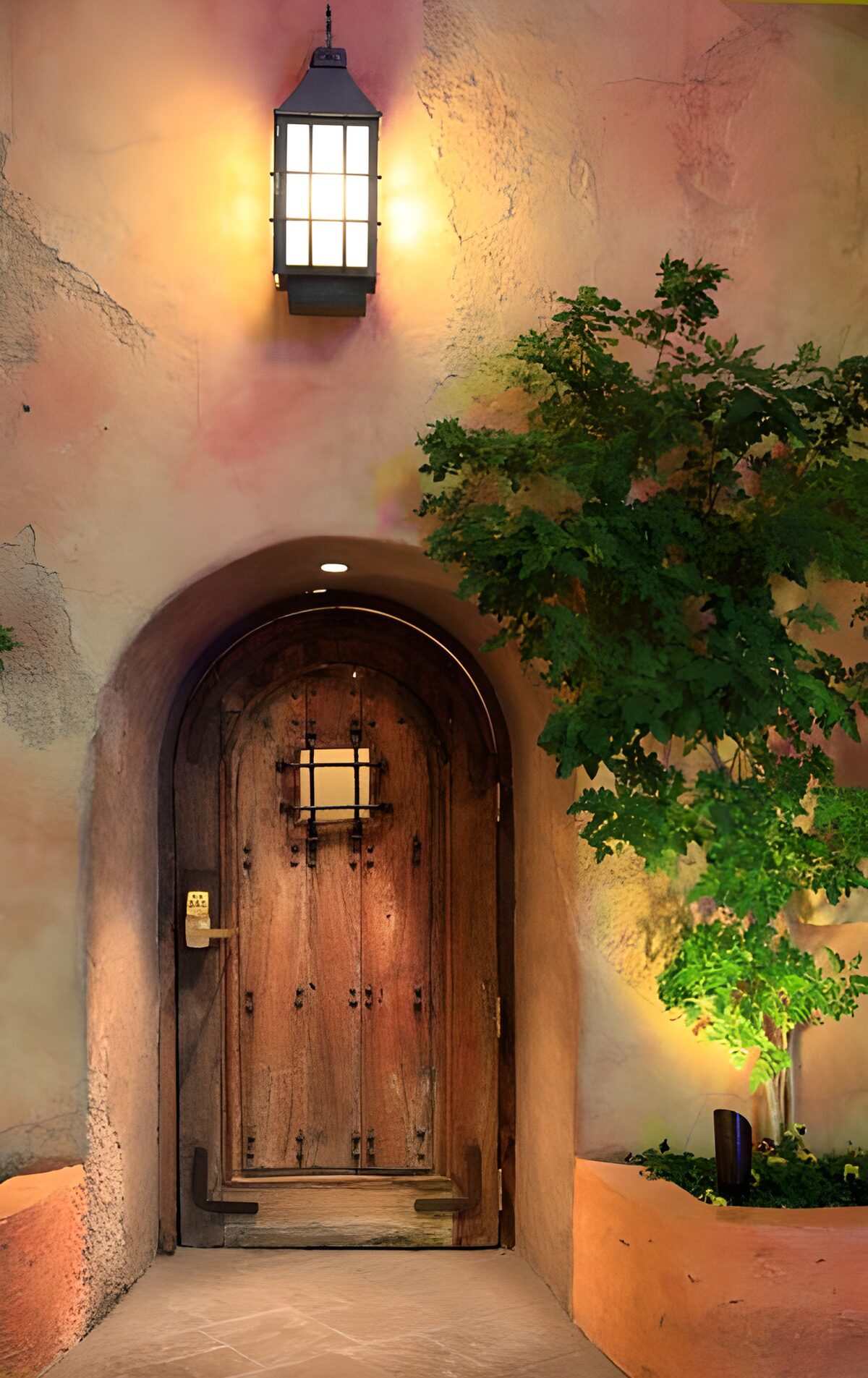 Arched wooden door in warm lantern light