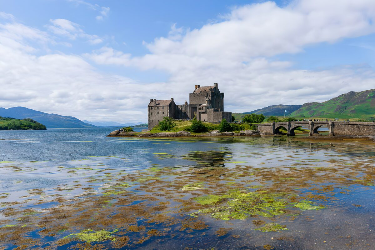 Island castle and bridge under open skies