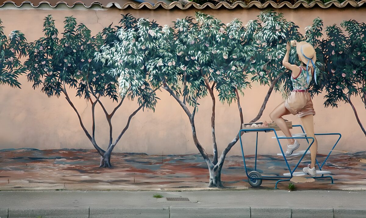 Woman picking fruit in a summer mural