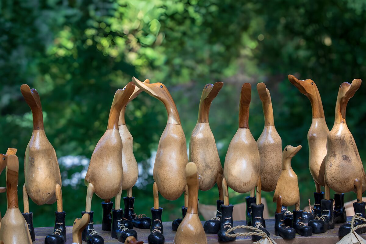 Wooden birds in boots and warm light