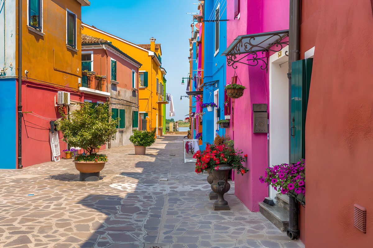 Colourful houses on a sunlit stone lane