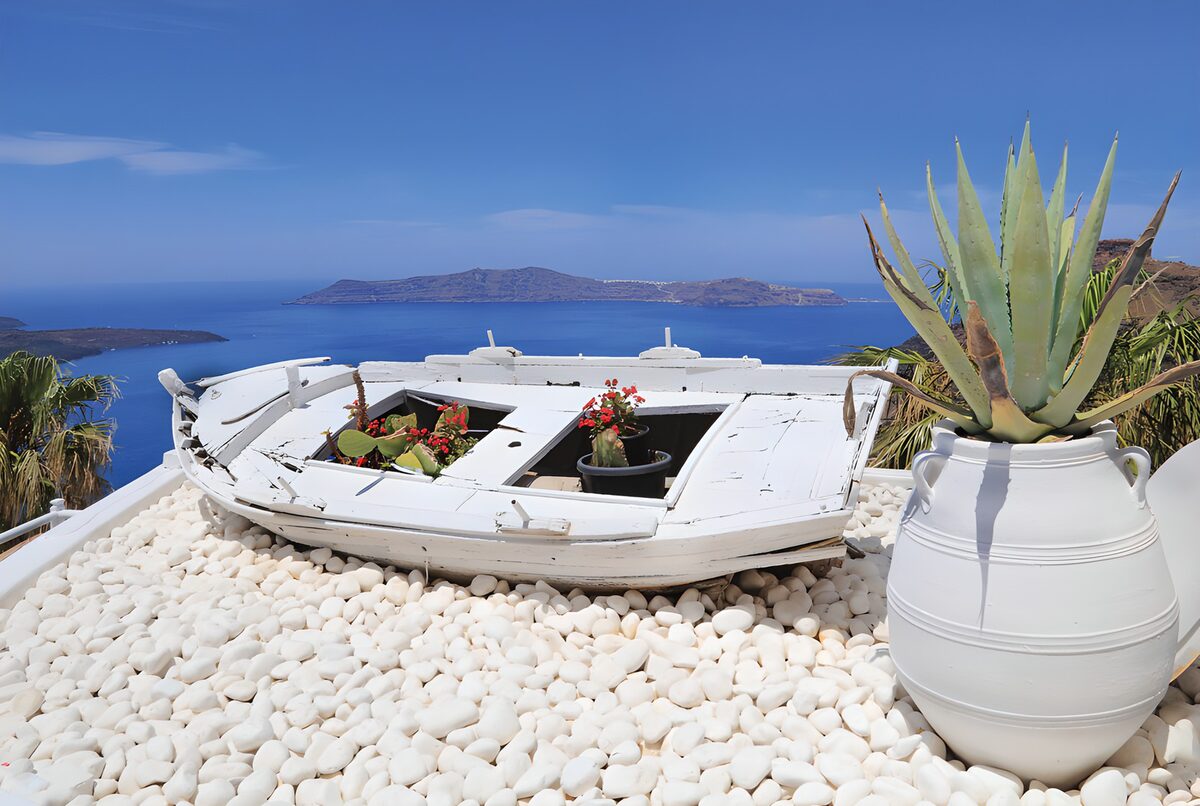 White boat planter by the blue sea