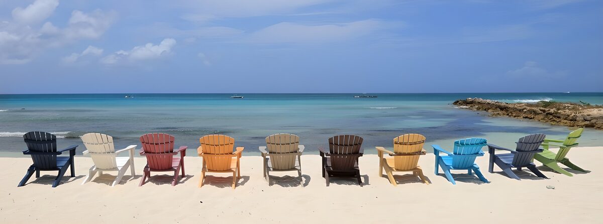 Colourful beach chairs by a calm sea