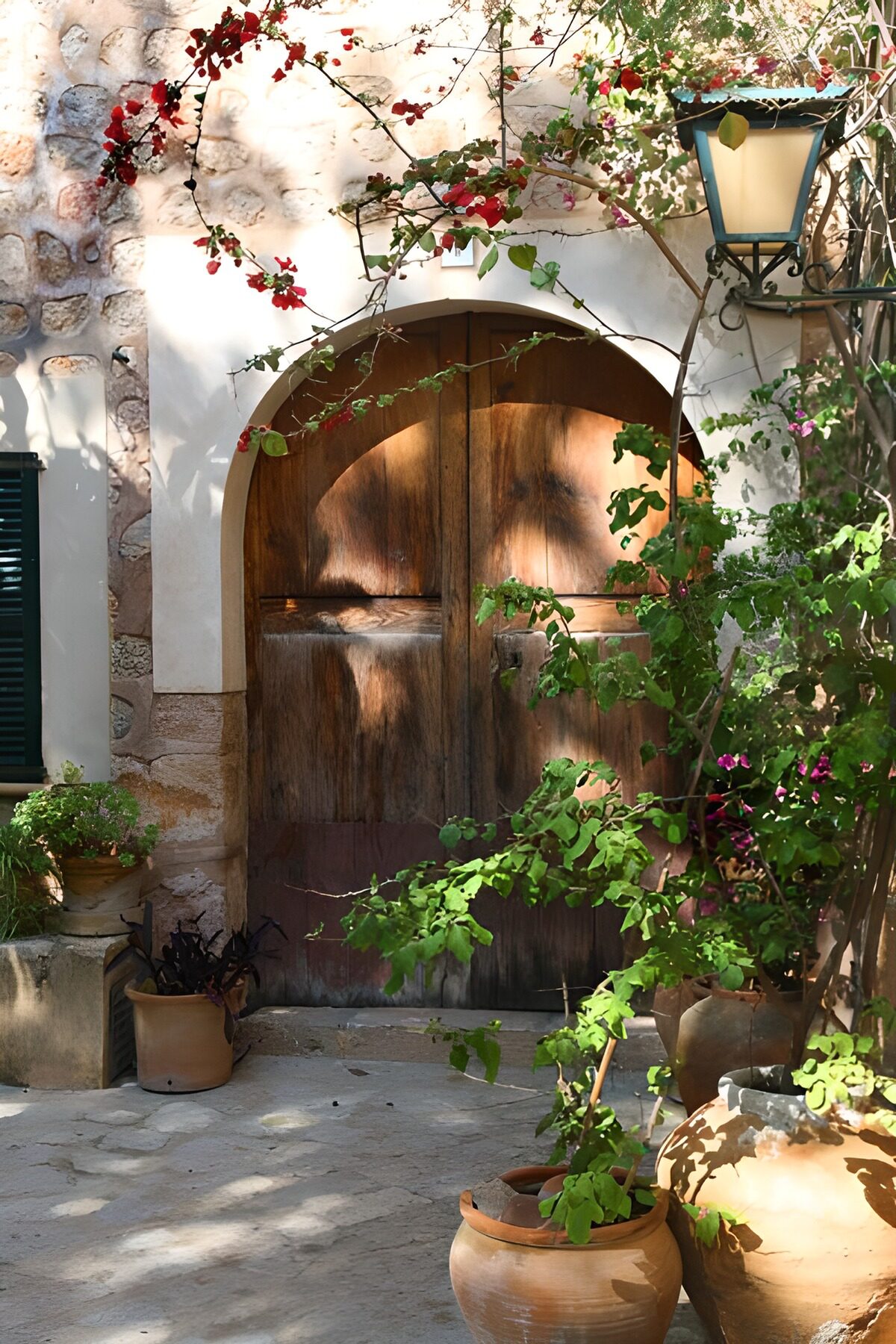 Arched wooden door with pink blossoms