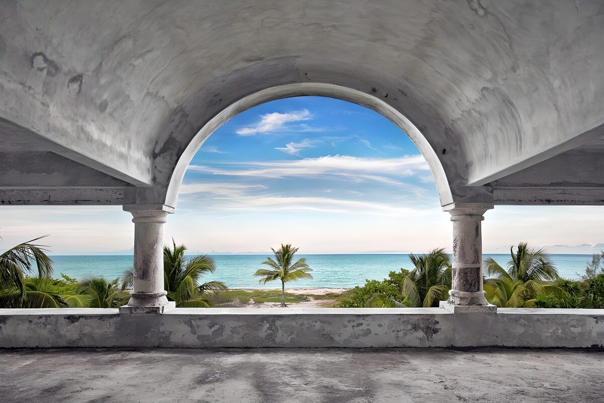 Tropical sea view through a weathered arch