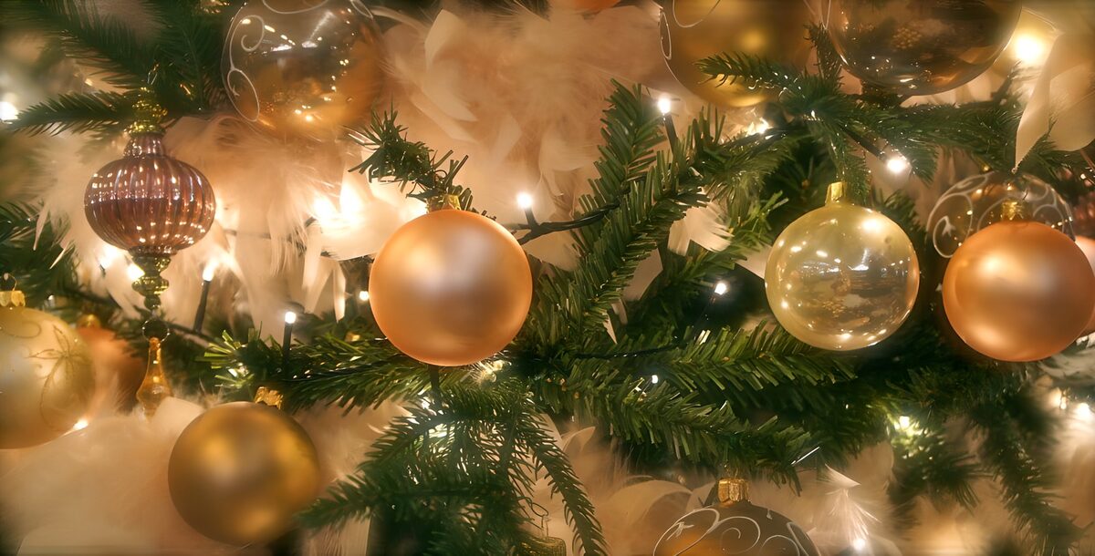 Gold Christmas baubles and warm lights