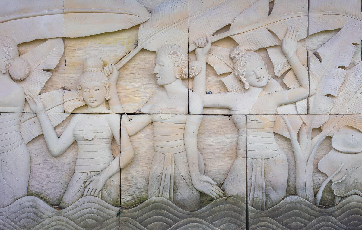 Women and waves in pale carved relief