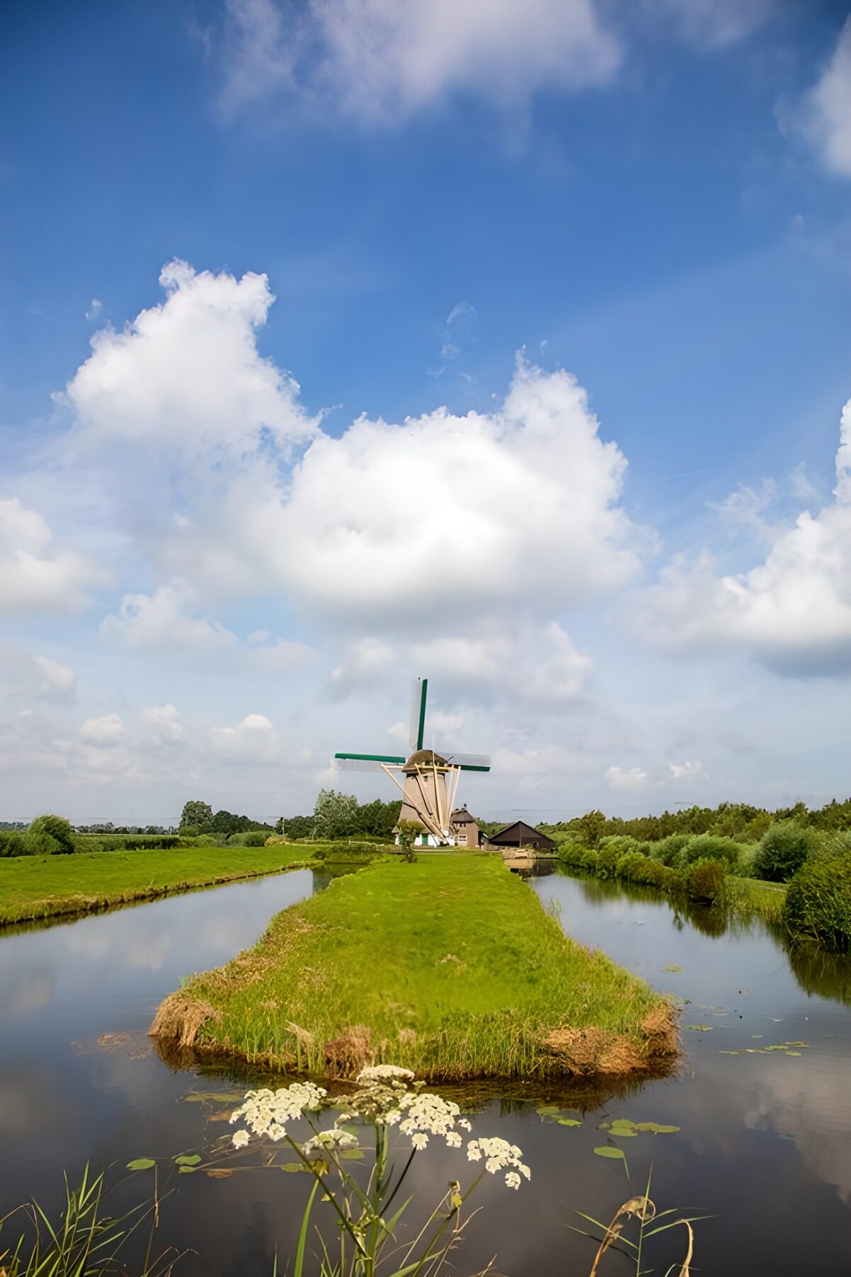 Windmill between quiet waterways