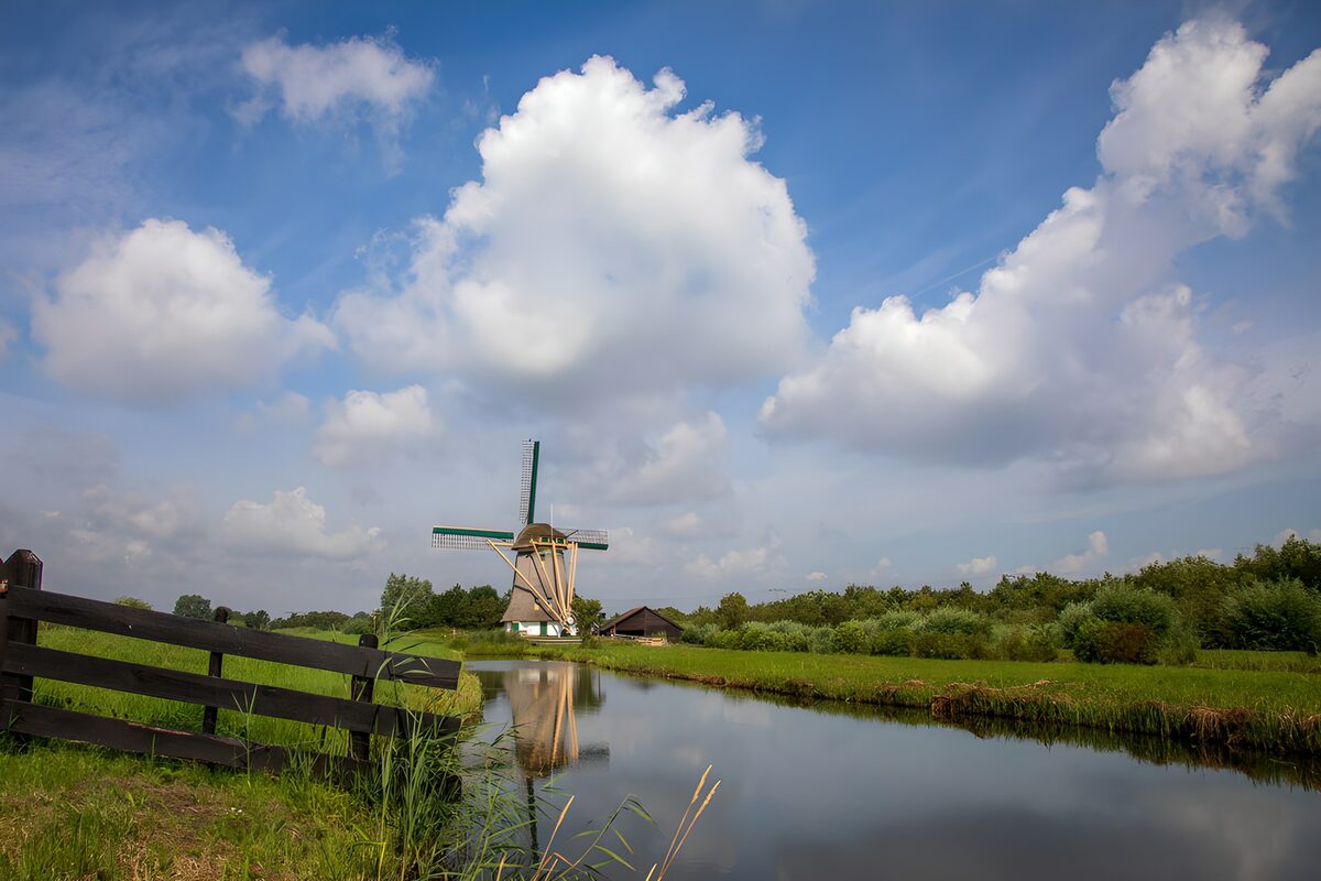 Windmill by a quiet canal