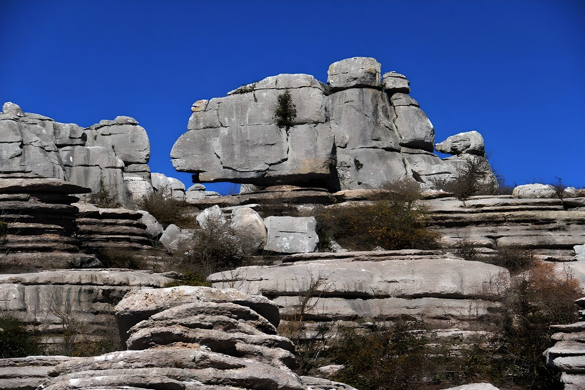 Weathered grey rocks beneath a blue sky