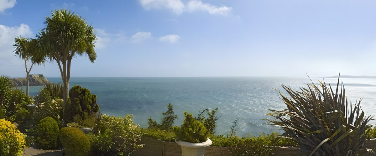 A sunlit garden overlooking the sea