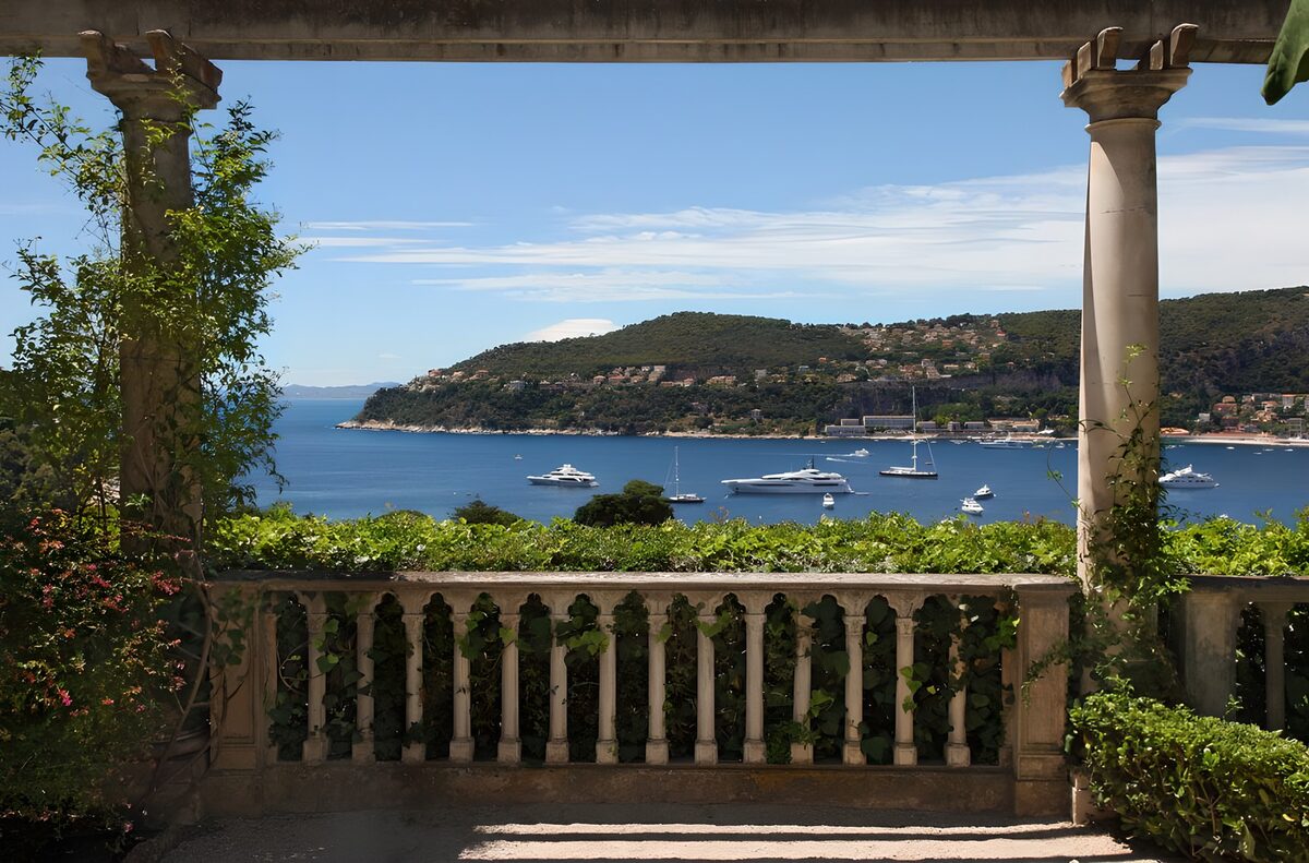 Shaded terrace above a yacht-filled bay