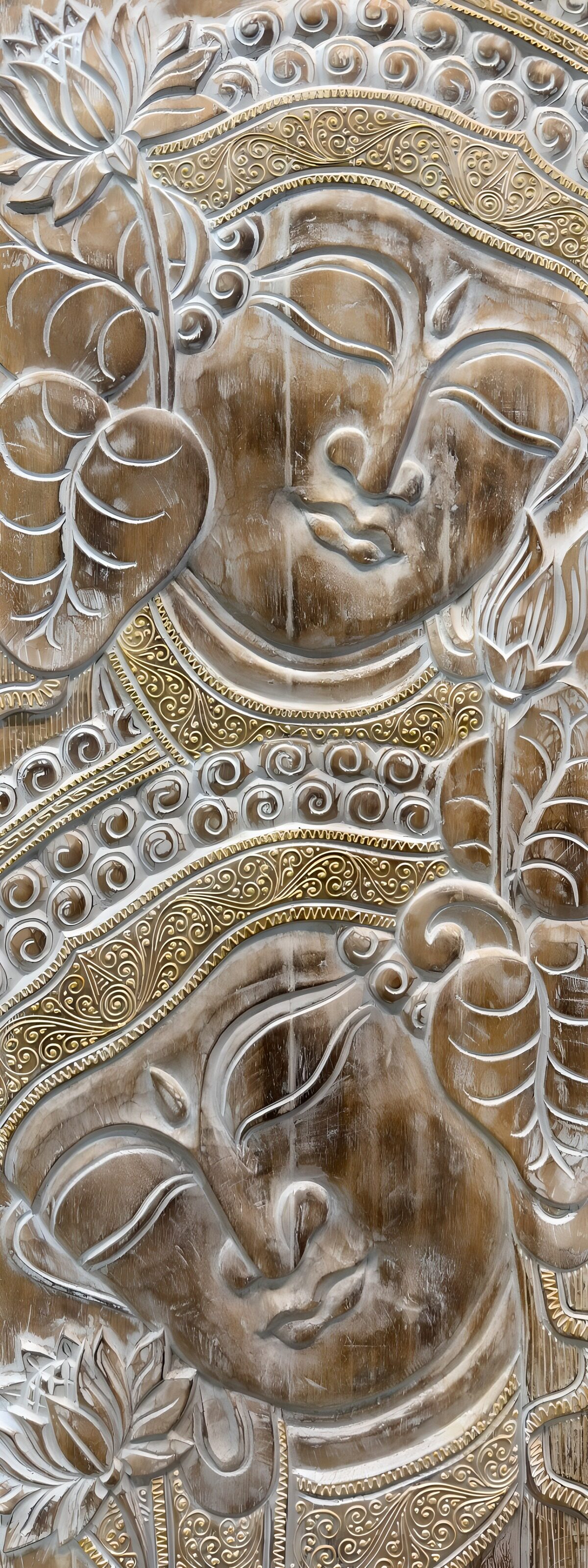 Two carved faces in white and gold