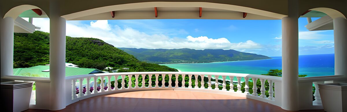 Shaded terrace above a turquoise bay