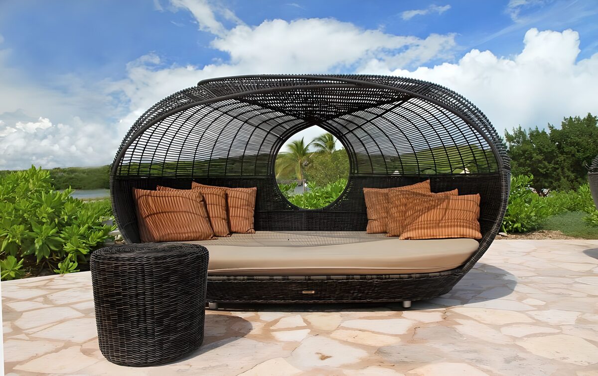 Woven daybed on a sunlit terrace