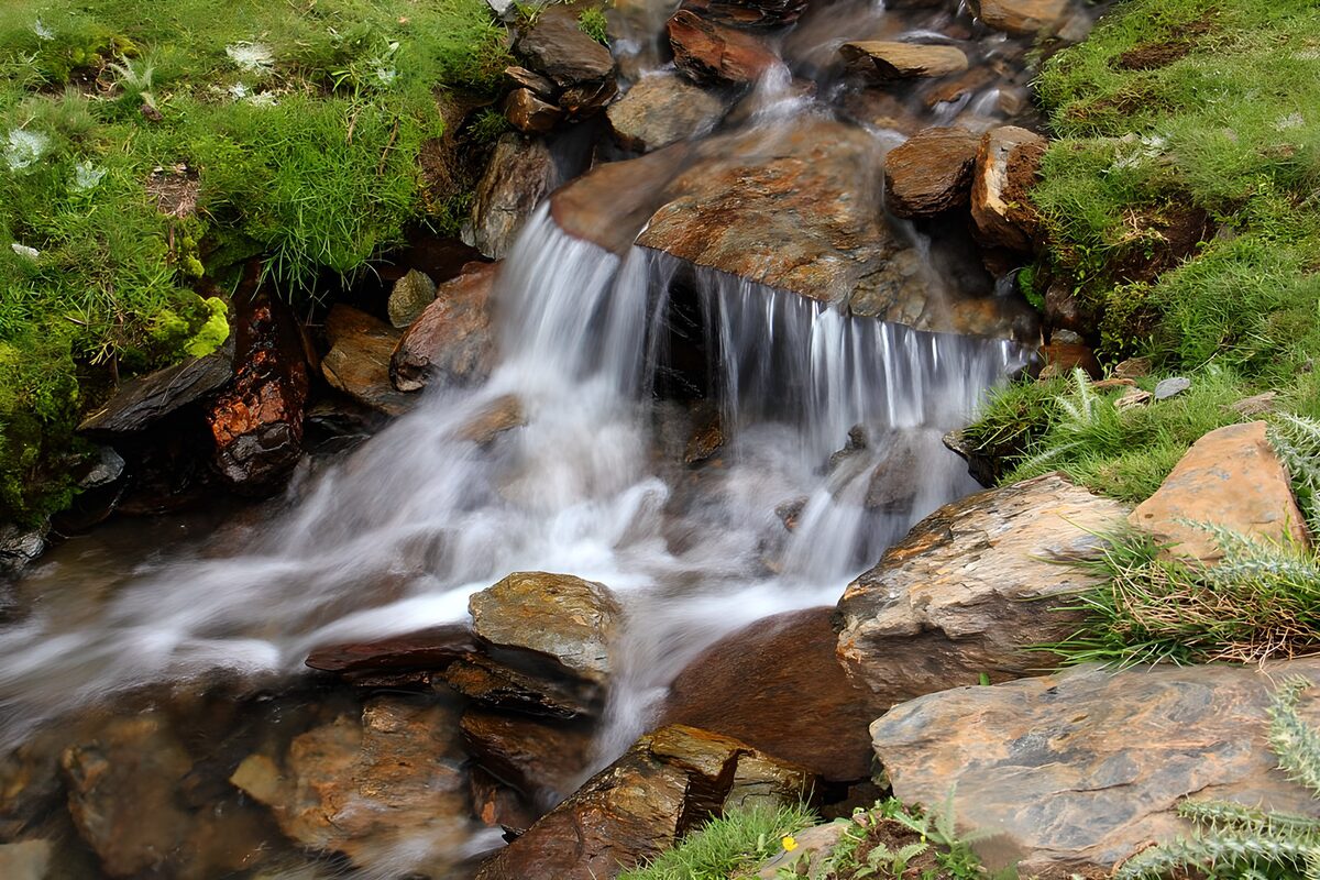 Small waterfall over weathered rocks
