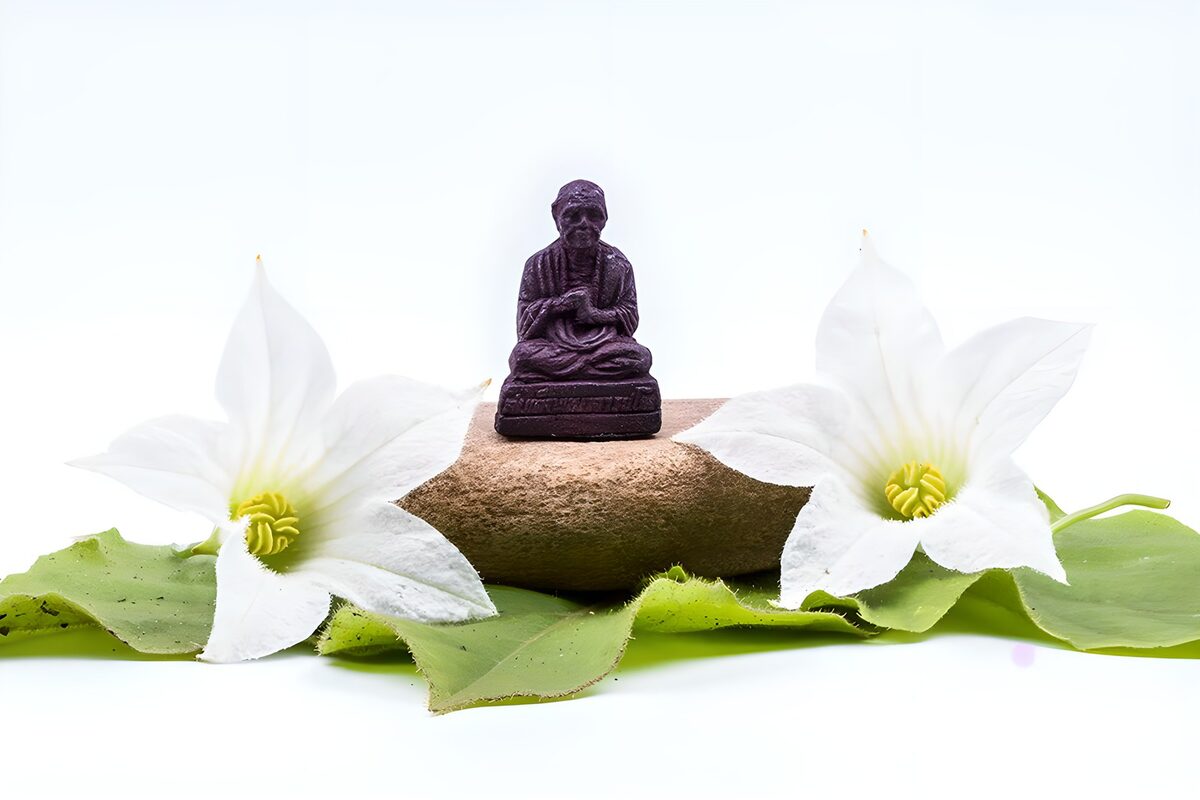 White flowers and a figurine at rest