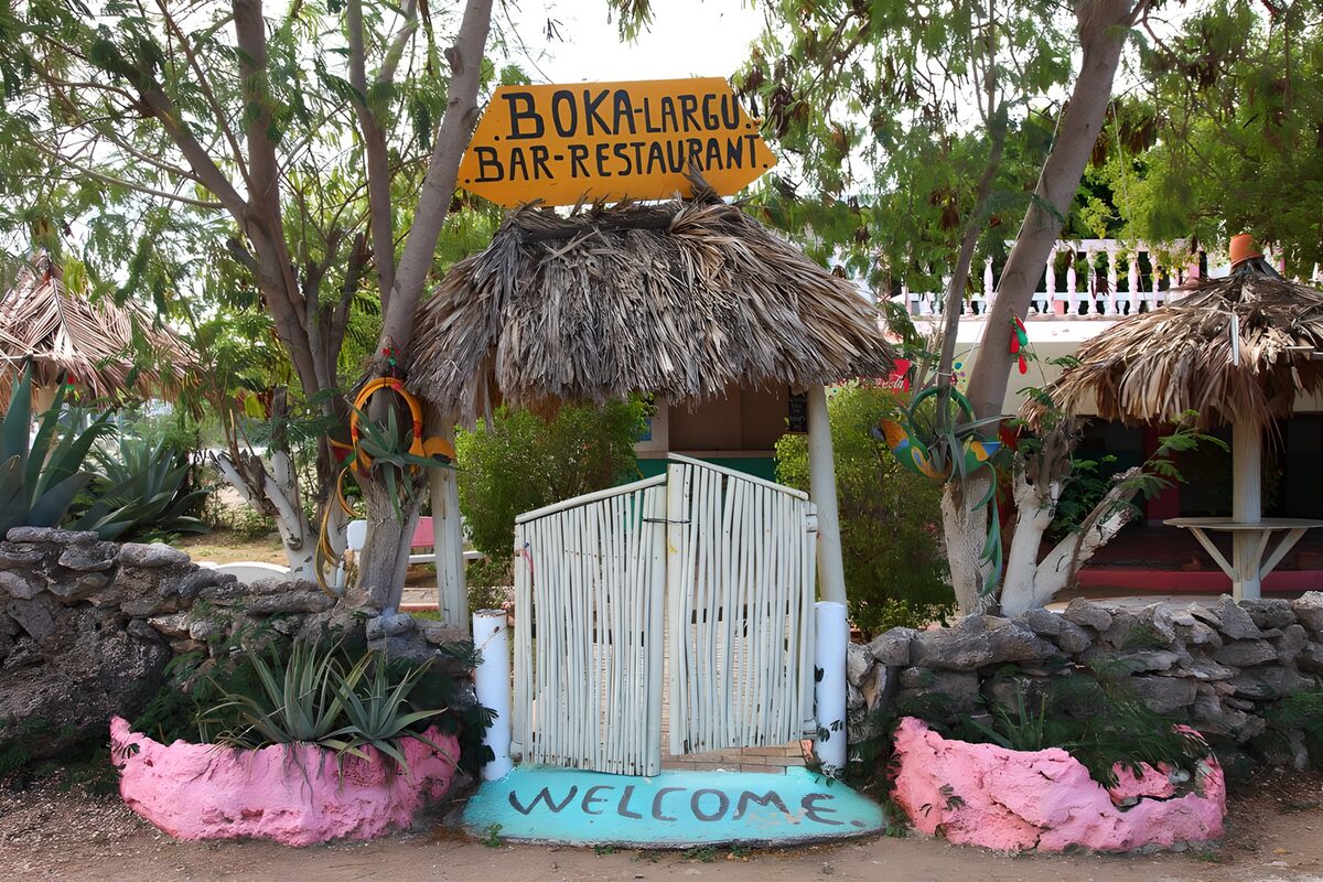 Rustic bar entrance in dappled shade