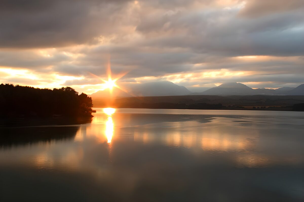 Sunset over a still mountain lake