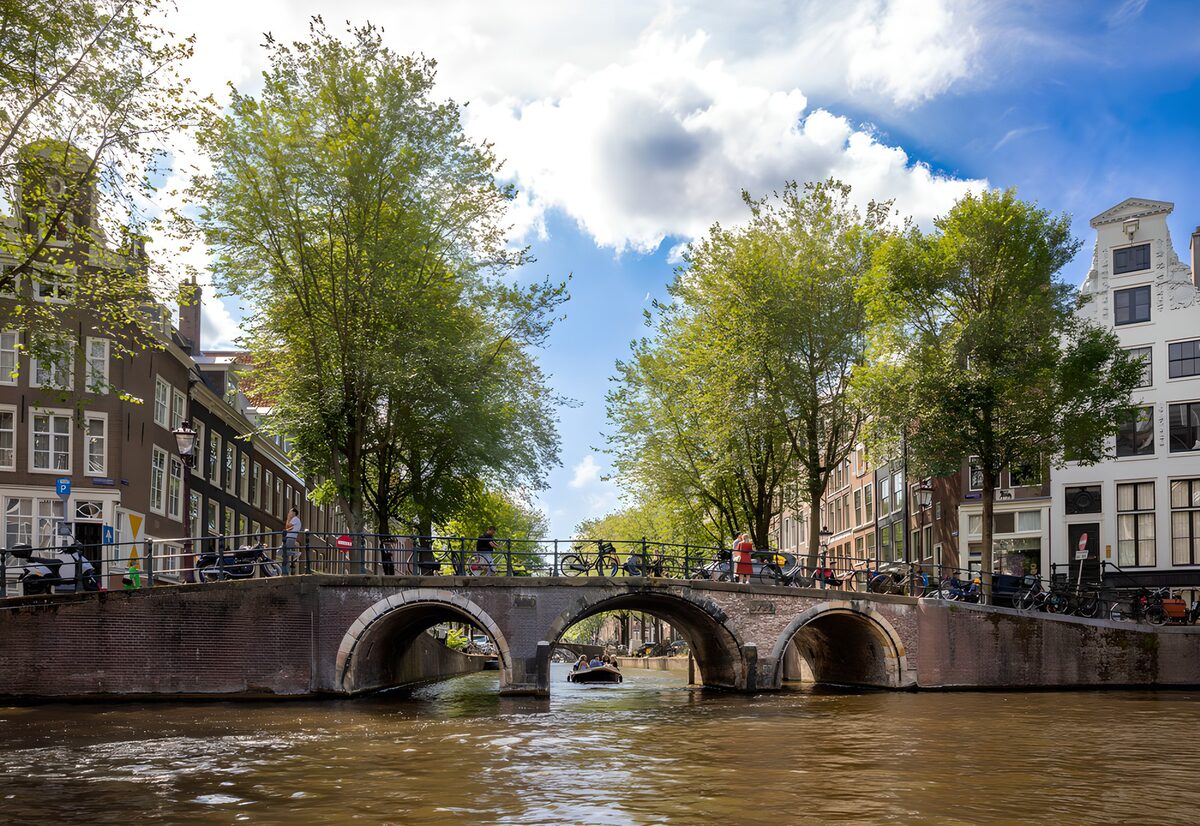 Three arches over a sunlit canal