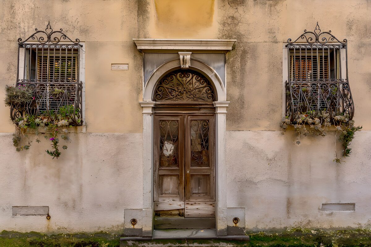Weathered doorway with flower boxes