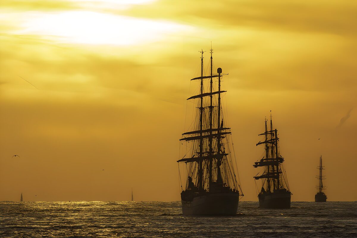 Tall ships against a golden sunset