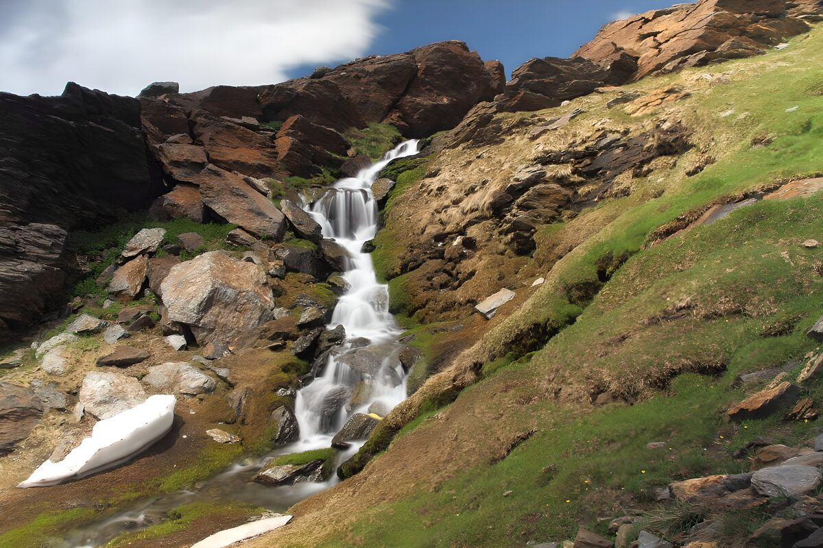Mountain waterfall in light and shade