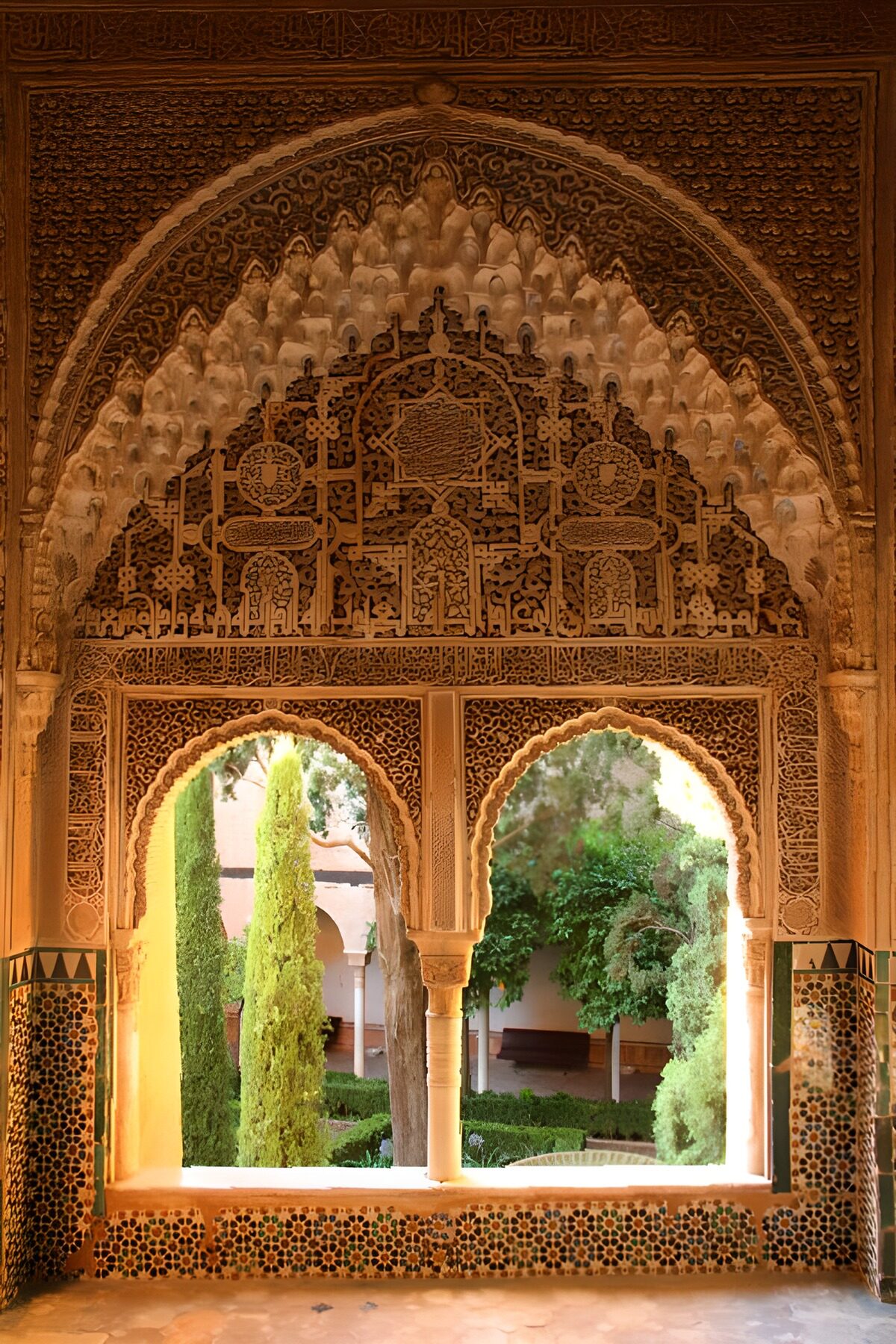 Ornate arches over a sunlit courtyard