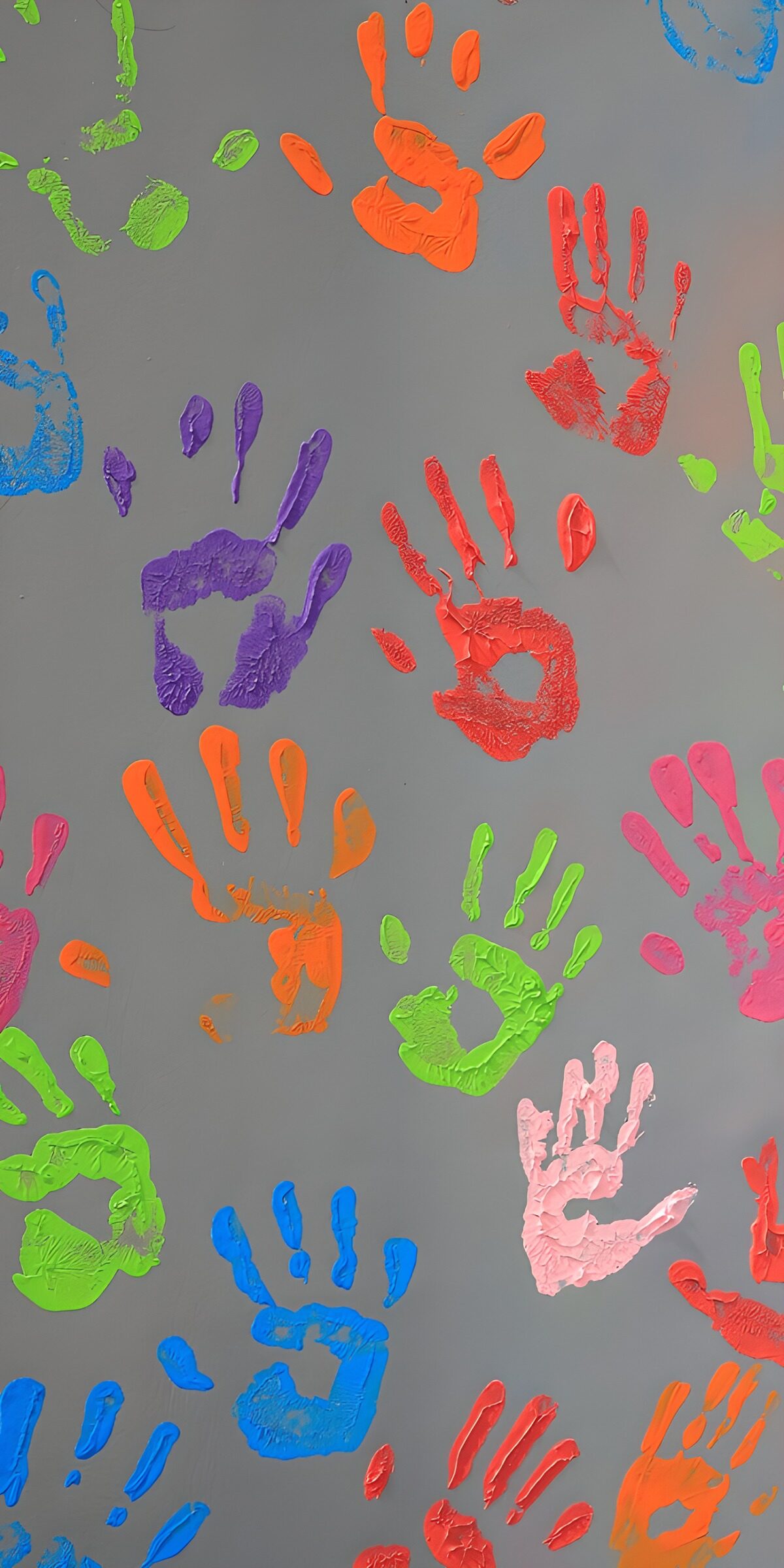 Colourful handprints on grey