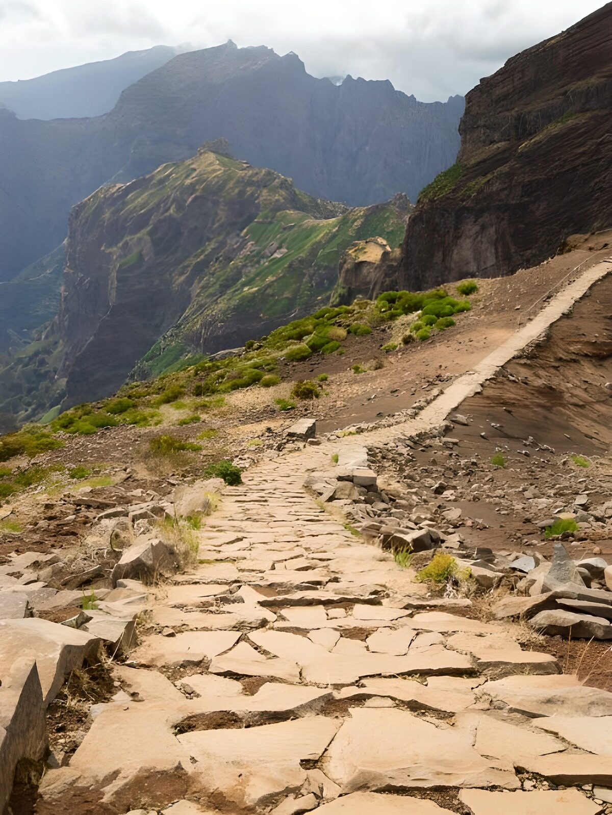 Stone path above a misty mountain valley