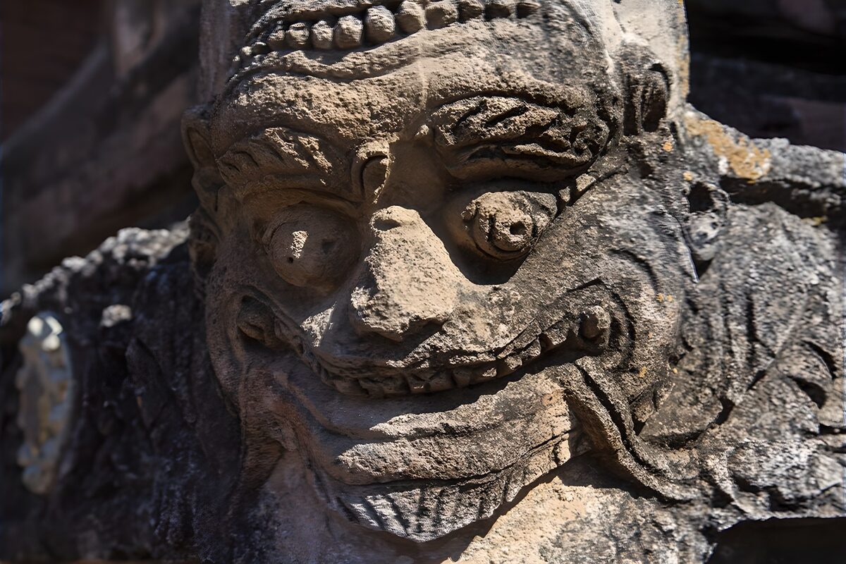 Weathered stone face in strong sunlight