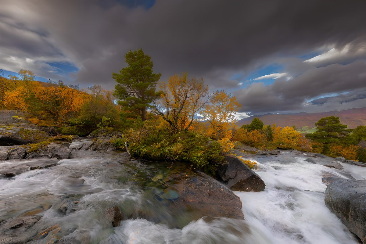 Autumn rapids beneath a brooding sky