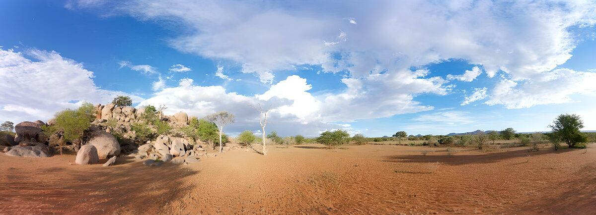 Rounded boulders under a wide blue sky